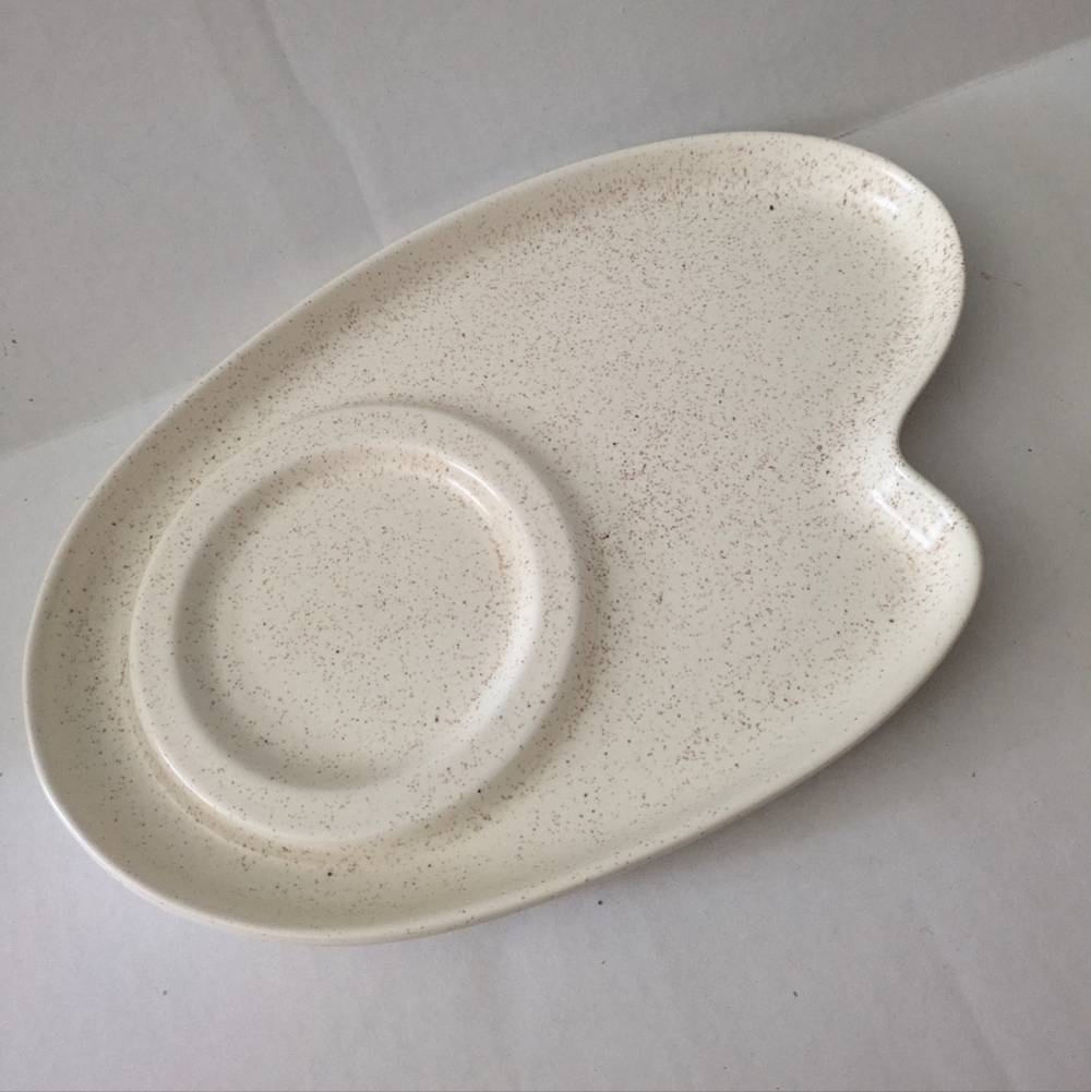 Retro speckled ceramic platter chip and dip.